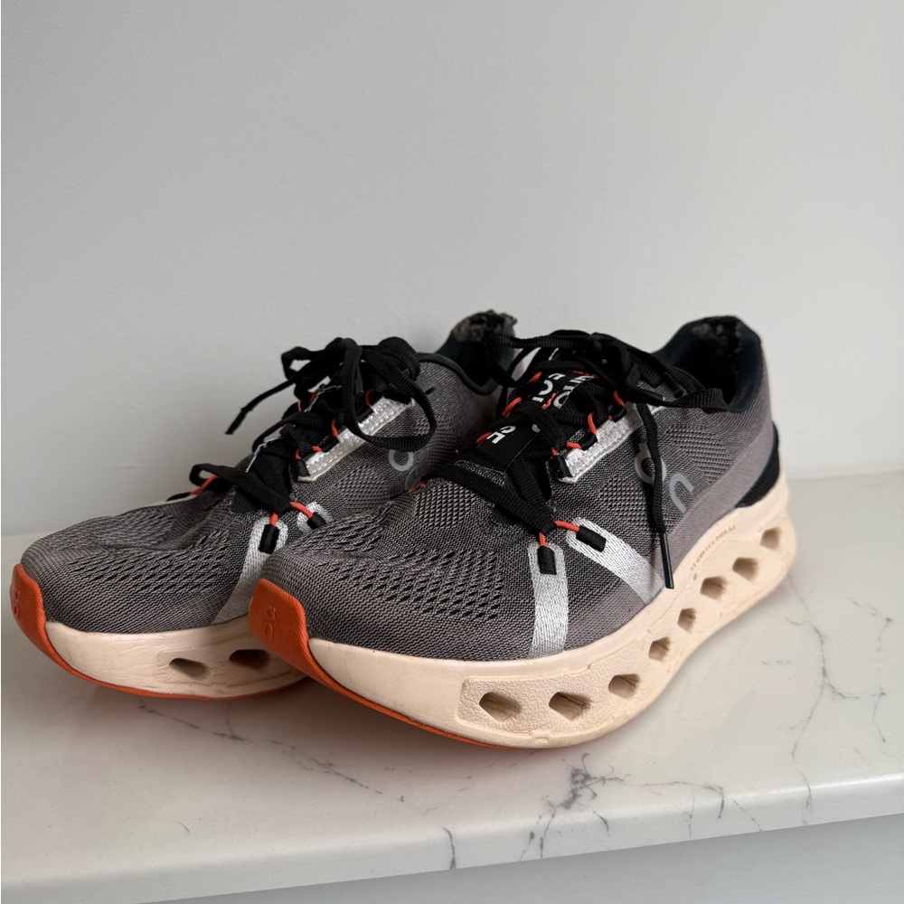 On Running Black and Orange Sneakers